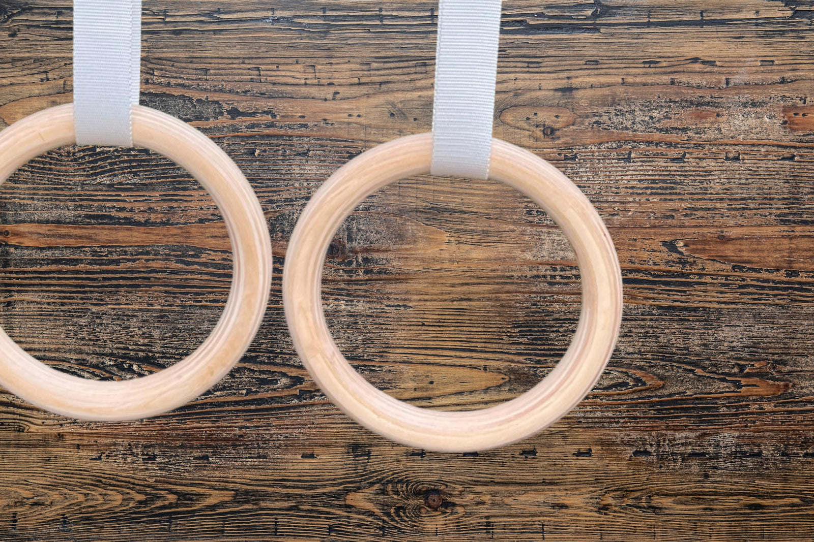 Atomic Iron wood gymnastic rings hanging from ceiling