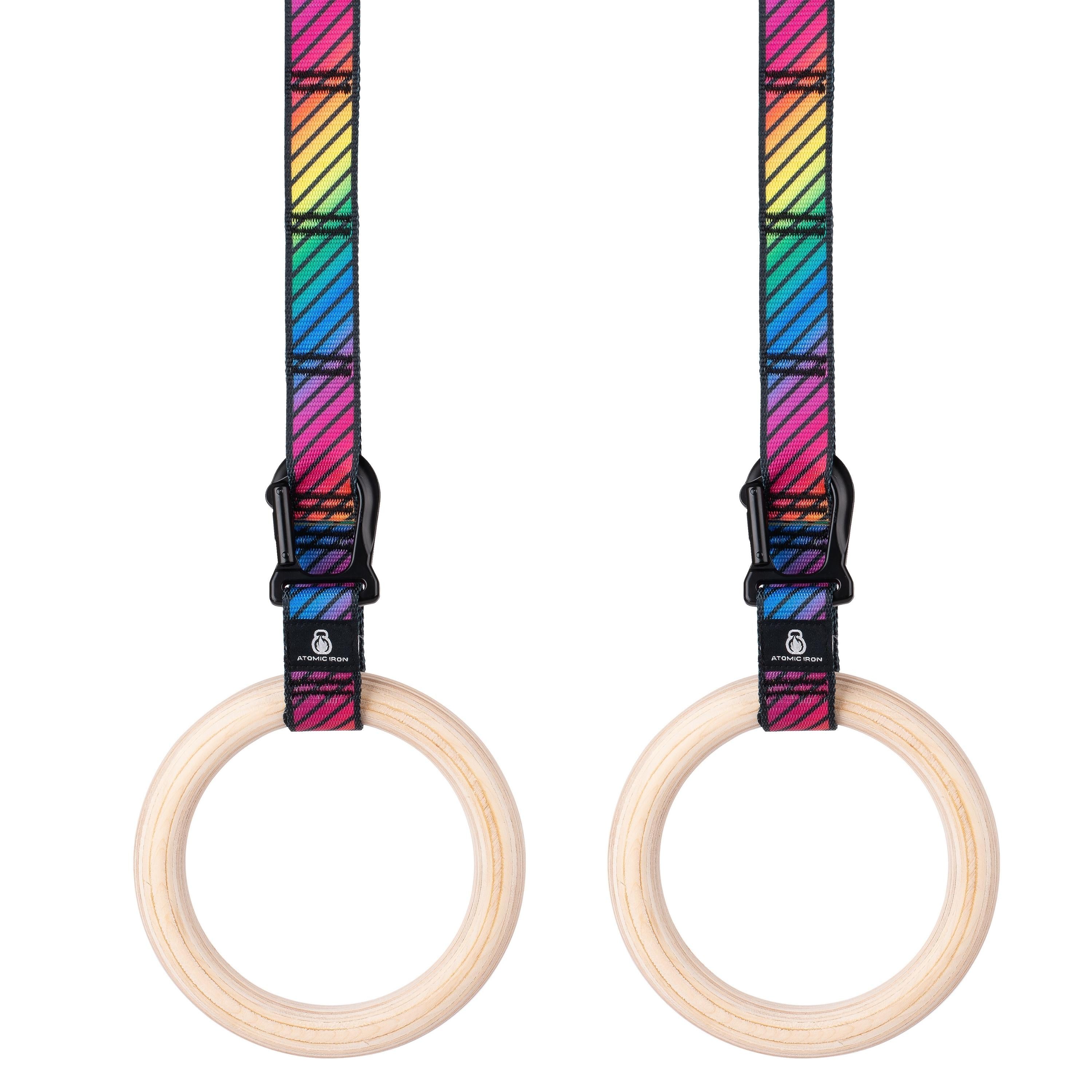 Pair of kids wooden gymnastic rings hanging side by side with colourful rainbow straps - Atomic Iron