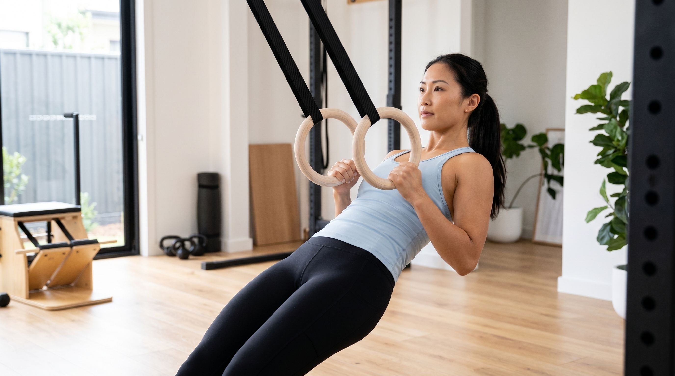Beginner performing ring rows with gymnastic rings