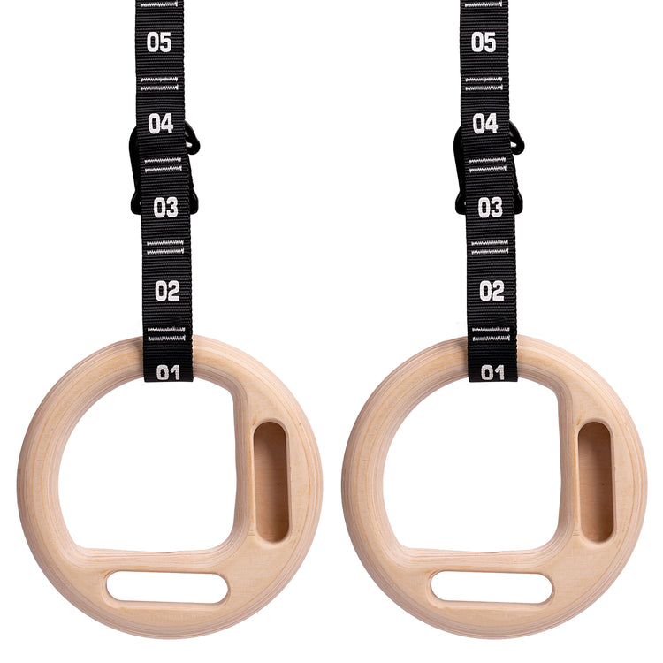 Climbing rings with hangboard edge and numbered carabiner straps by Atomic Iron