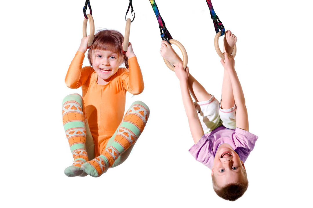 Children playing on Atomic Iron gymnastics rings